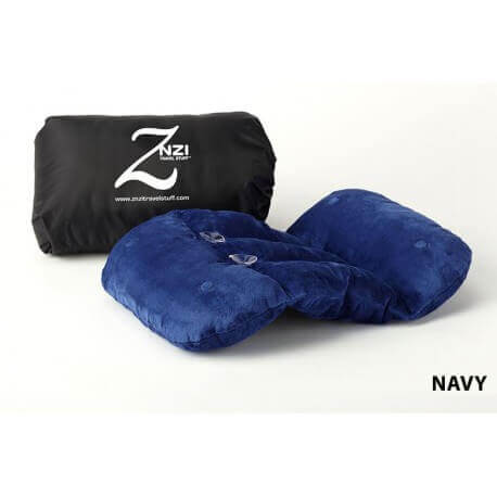 A navy blue Znzi Travel Pillow is shown next to its black carrying case. The carrying case is labeled with the "ZNZI" logo and website. The text "NAVY" appears in the bottom right corner of the image.
