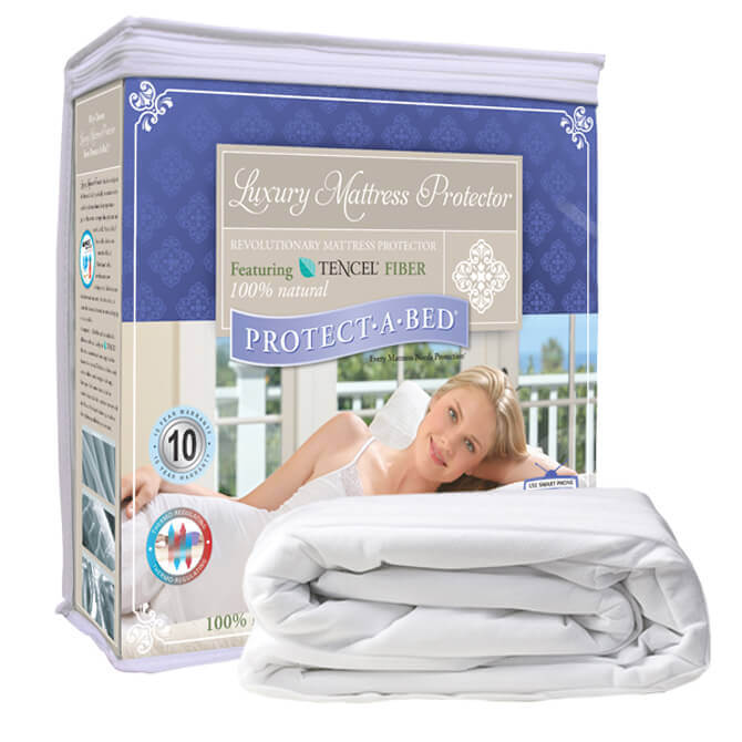 The image shows a packaged "Protect-A-Bed" luxury mattress protector. The box features an image of a woman relaxing in bed, and text highlighting its Tencel fiber composition and a 10-year warranty. The Protect A Bed mattress protector is also shown folded next to the packaging.