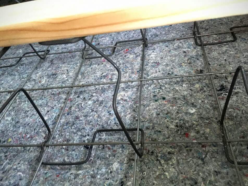 Traditional older box spring showing exposed heavy gauge wires
