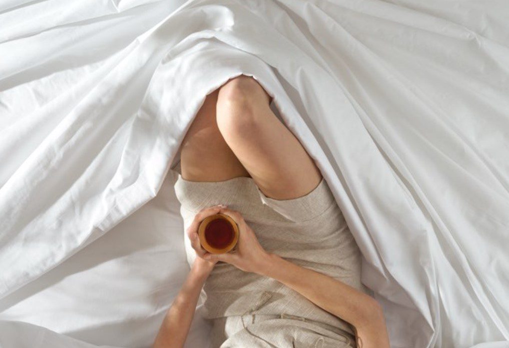 Lying near the edge of the Saatva HD mattress