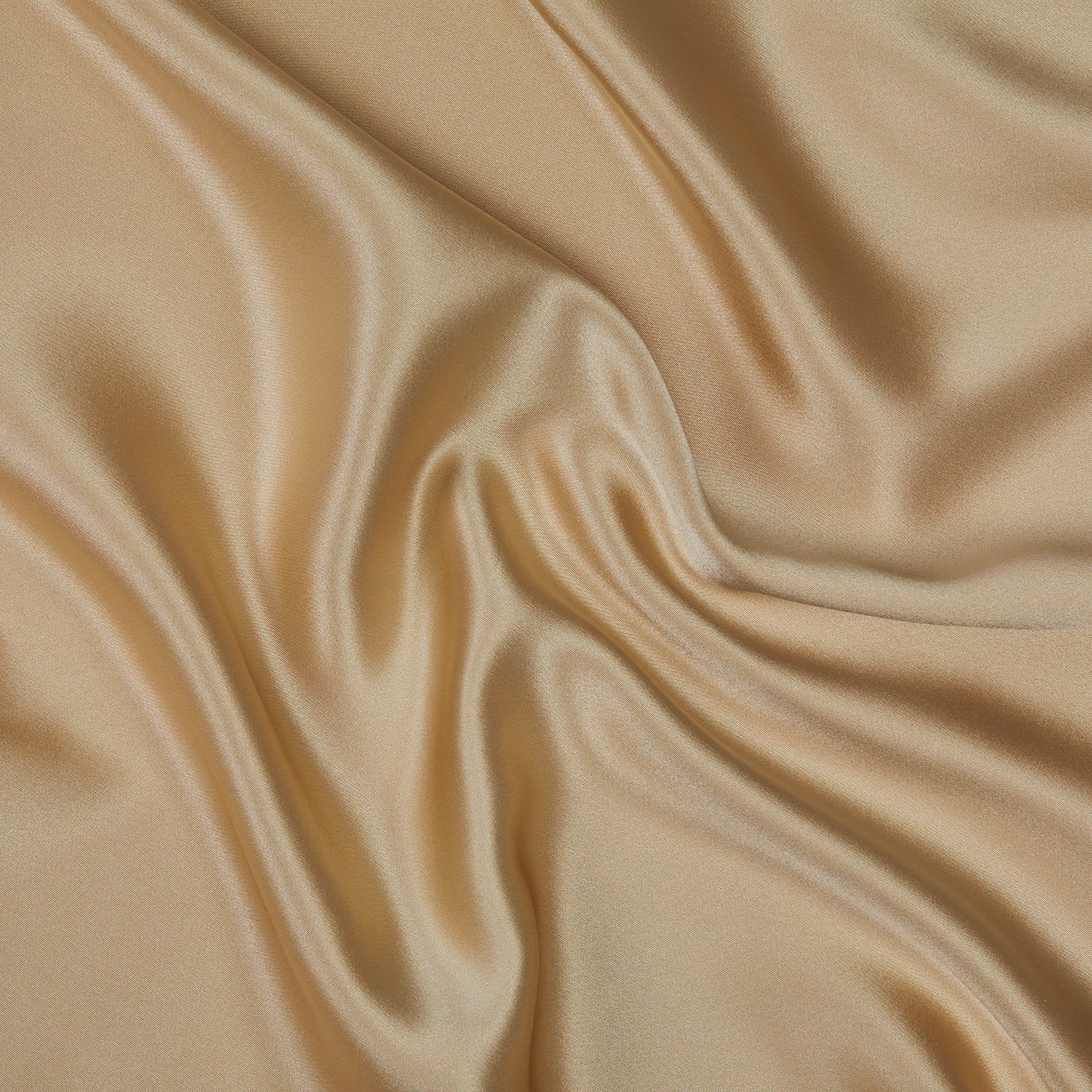 A close-up image of a Silk Pillowcase. The material has a smooth, shiny surface and exhibits soft, flowing folds that create a sense of gentle movement and luxury. The rich, shimmering texture highlights the pillowcase's elegant and sophisticated appearance.
