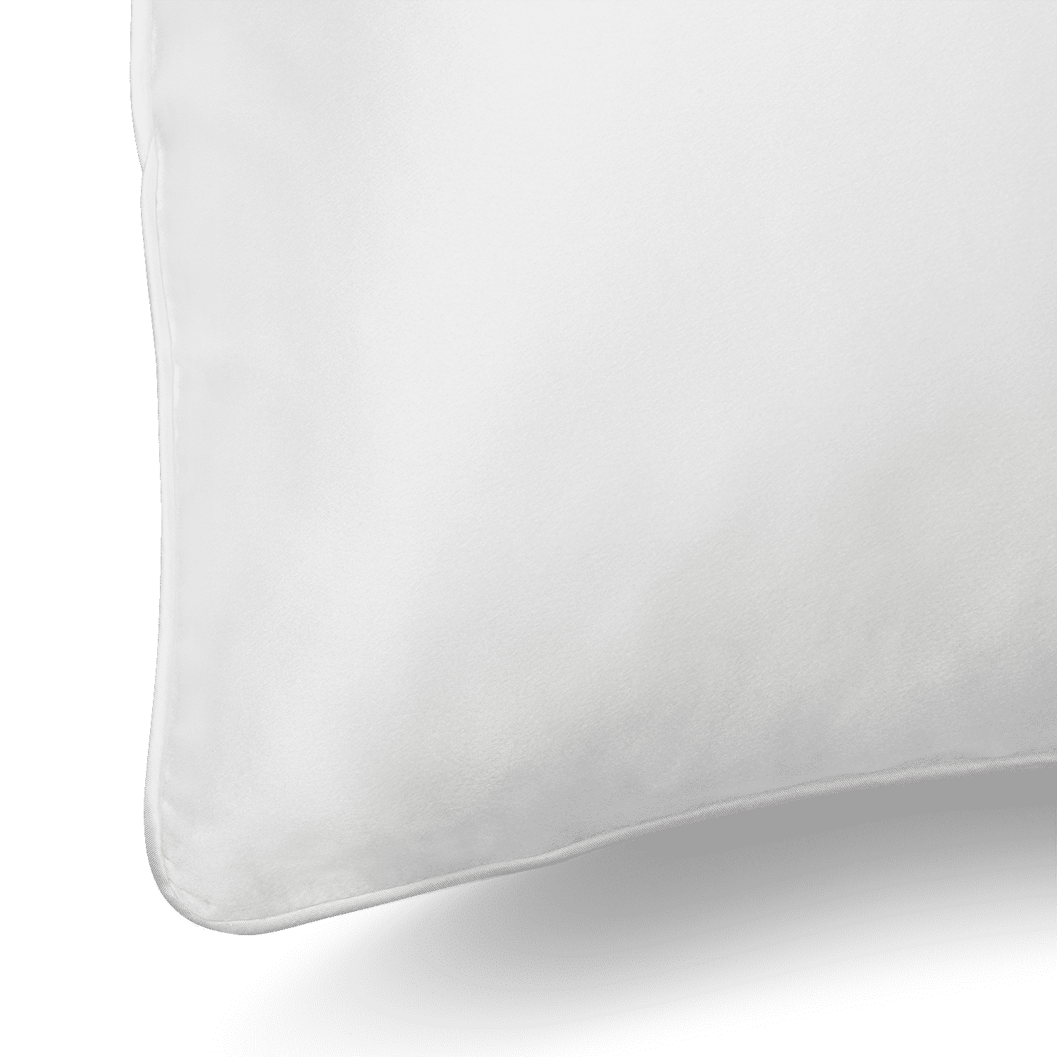 Close-up of a Silk Pillowcase with smooth fabric. The corner of the pillowcase is visible, showcasing clean lines and a minimalist design. The background is plain and non-distracting, emphasizing the pillowcase's simplicity and softness.