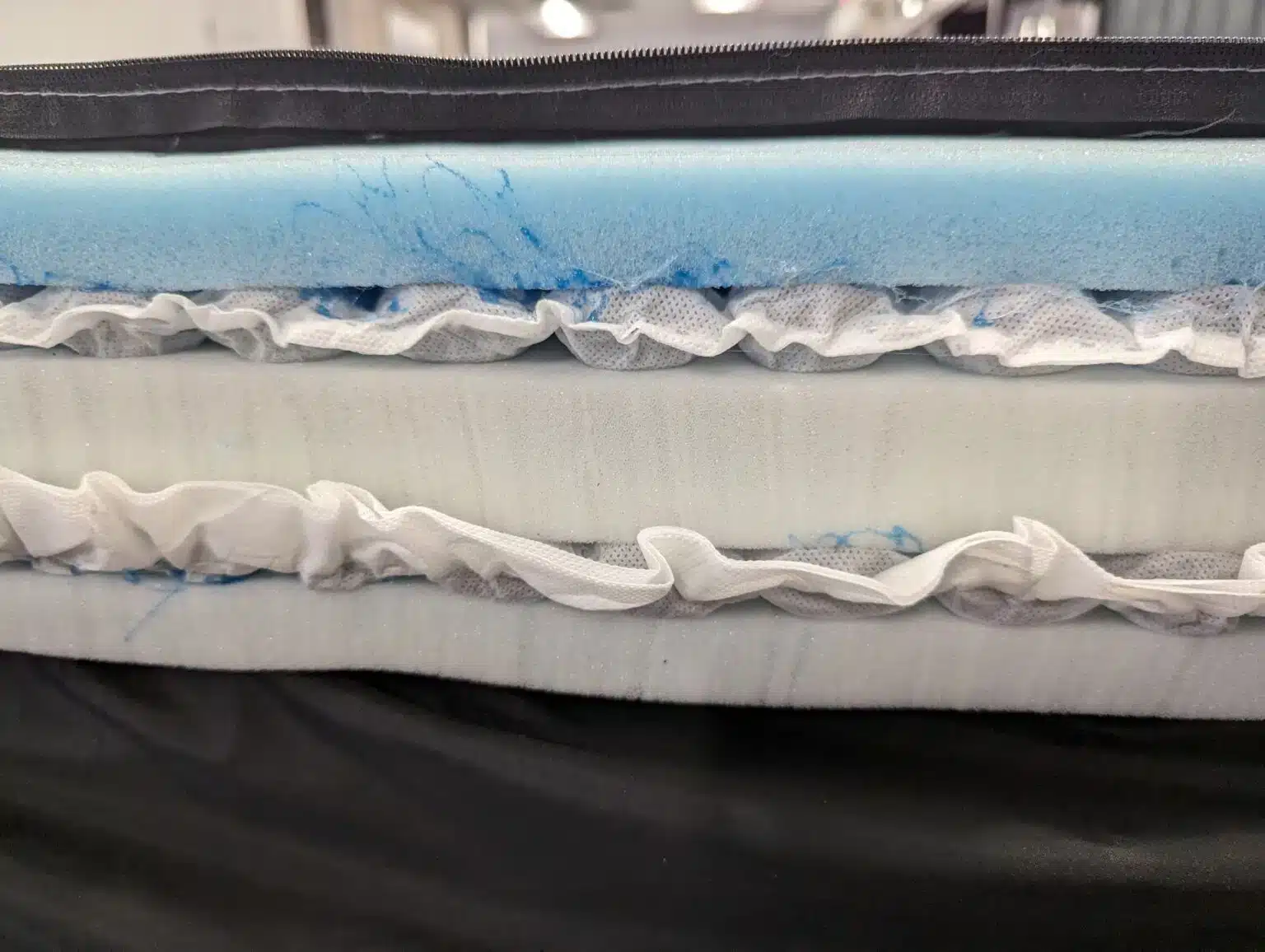 Inside view of the Helix Midnight Elite showing microcoils and foam