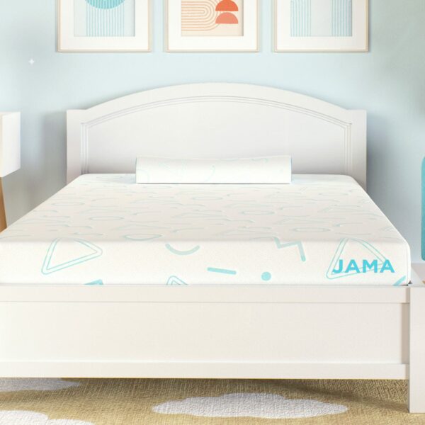 A neatly made bed with a white frame and the Mlily JAMA 5" Mattress featuring light blue geometric patterns. A bolster pillow rests at the head of the bed. Nearby are a white nightstand with a teddy bear on it, a turquoise chair, and wall art above the bed.