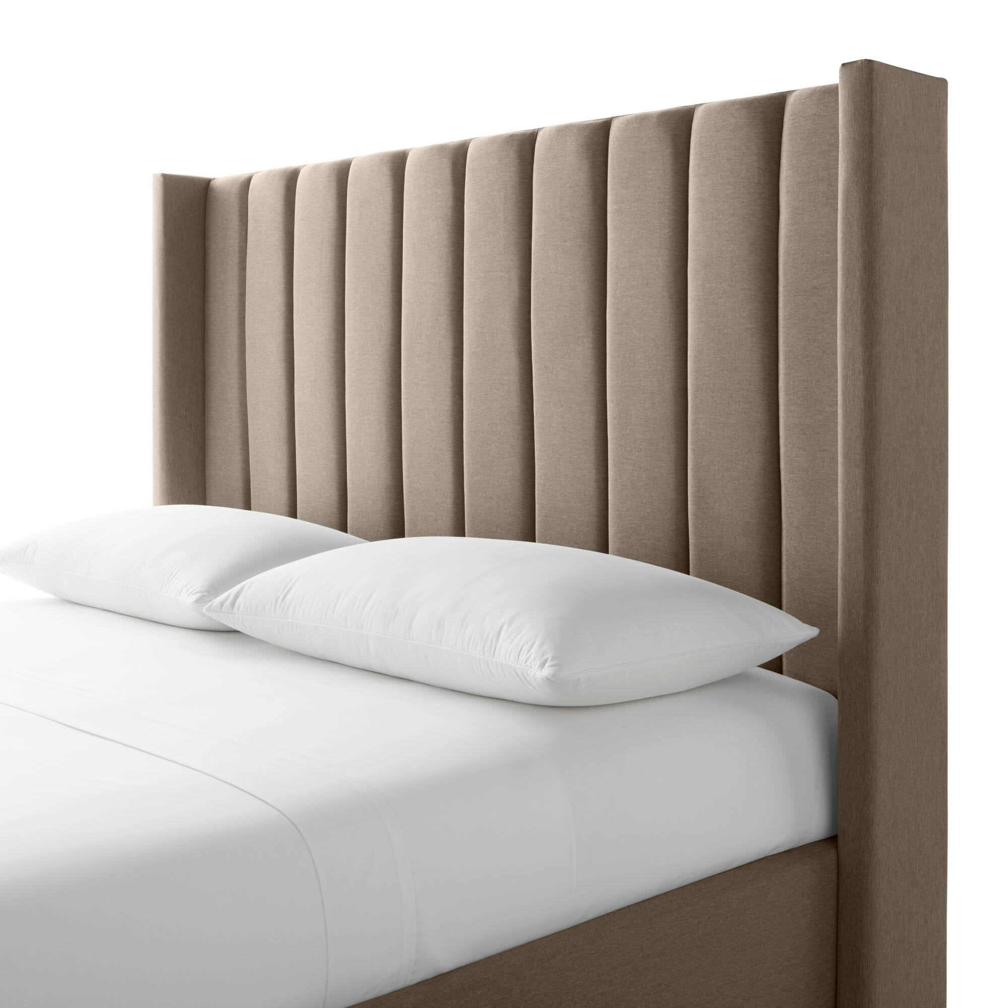 A beige upholstered bed, featuring the Blackwell Headboard with evenly spaced vertical seams for a modern, elegant appearance, adorned with two white pillows. The bed is made with white bedding, and the mattress is neatly tucked in.