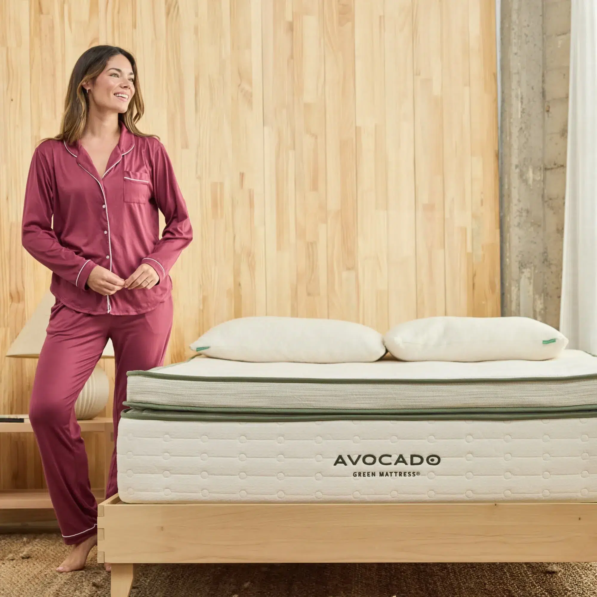 Avocado box top mattress on a wood bed frame