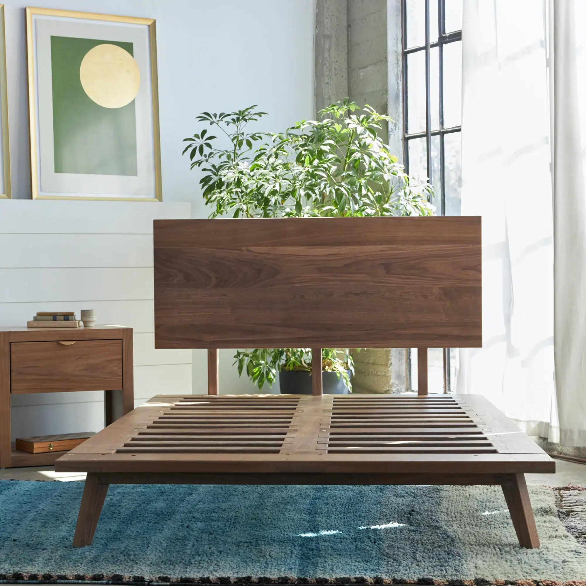 Avocado natural wood bed frame and furniture in a bedroom