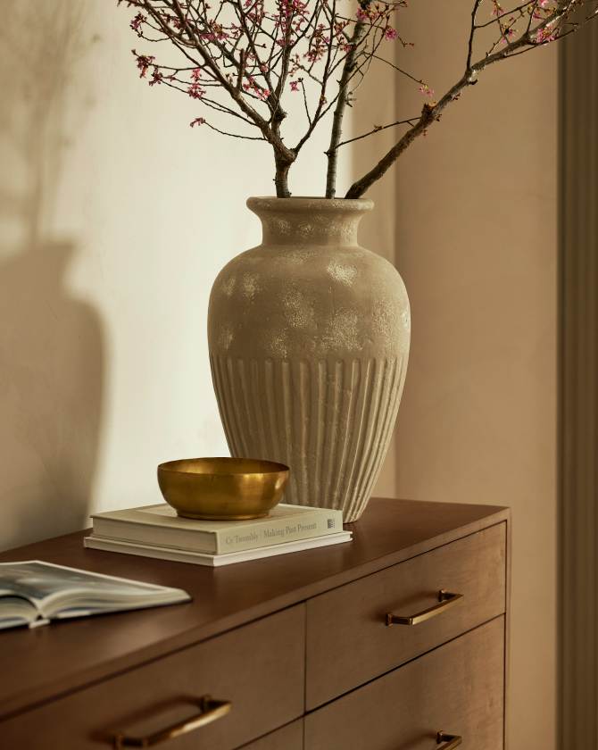 a vase with a branch in it