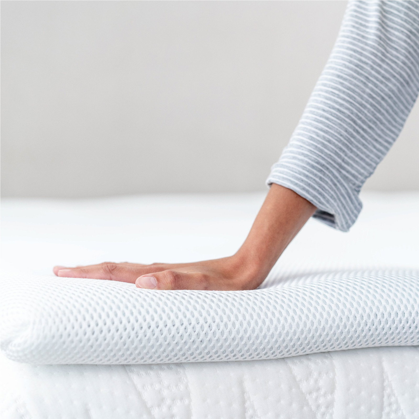 Perfectly Snug Smart Topper on a bed