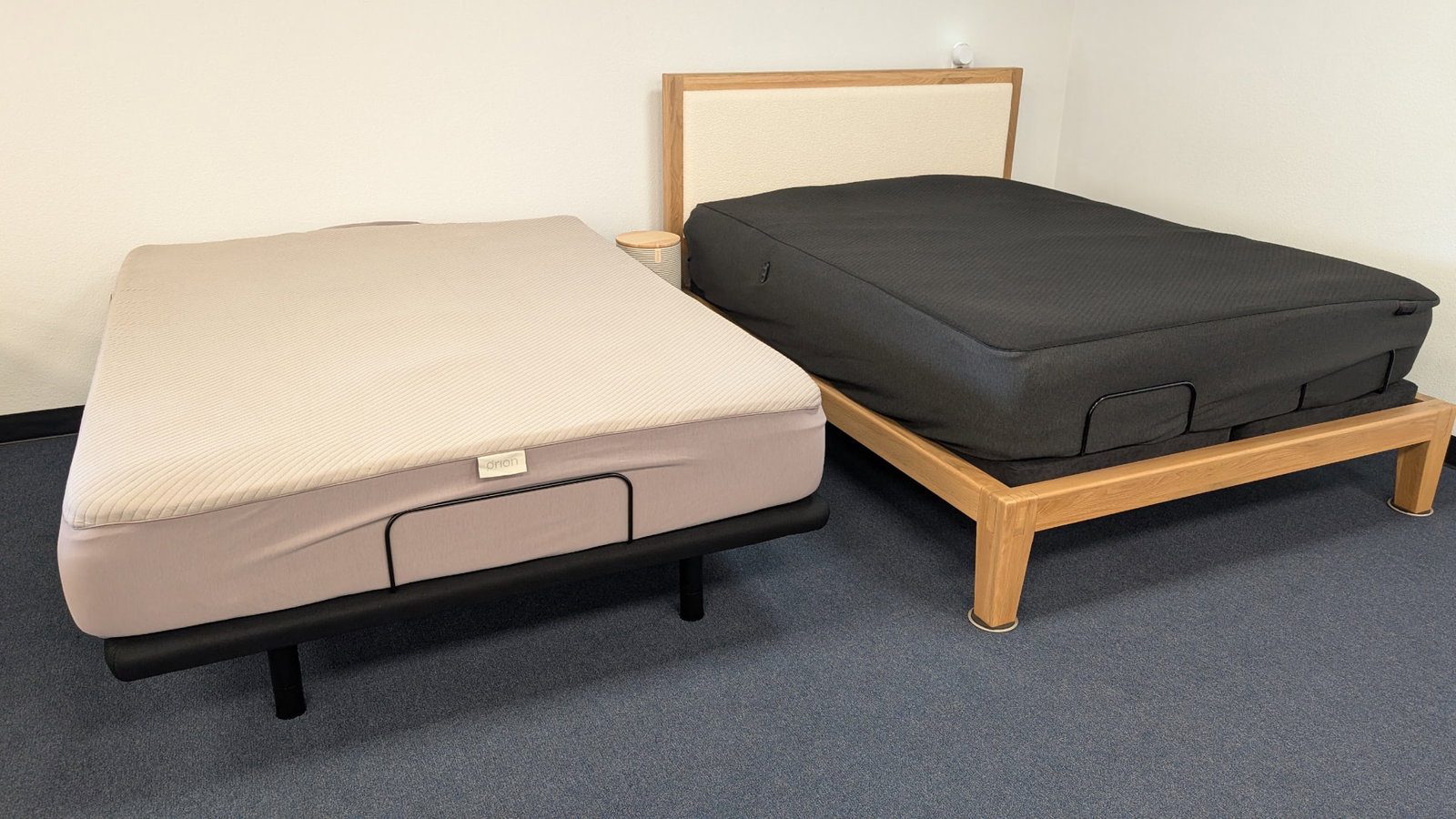 Orion Sleep smart cover on an adjustable base next to the Eight Sleep Pod at the Yawnder San Diego showroom