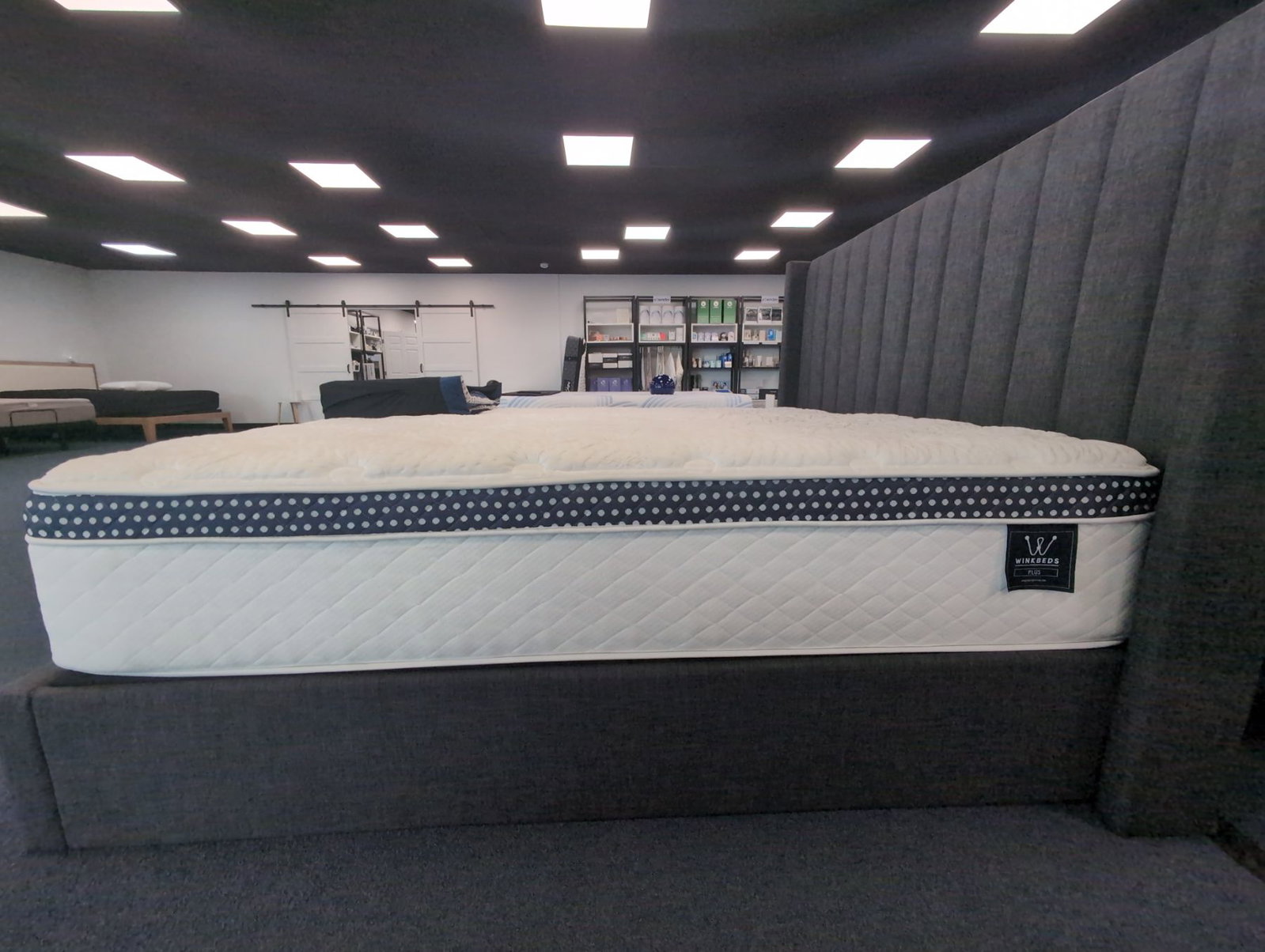 WinkBeds WinkBed Plus Featured photo — mattress on a made bed