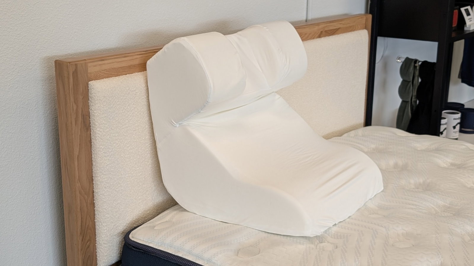 The Snorinator positional snoring pillow on a bed